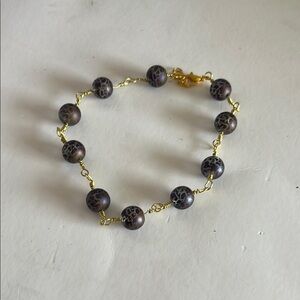 Gold and Black Bracelet with Elegant Bead Design